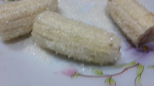 banana halves coated in sugar
