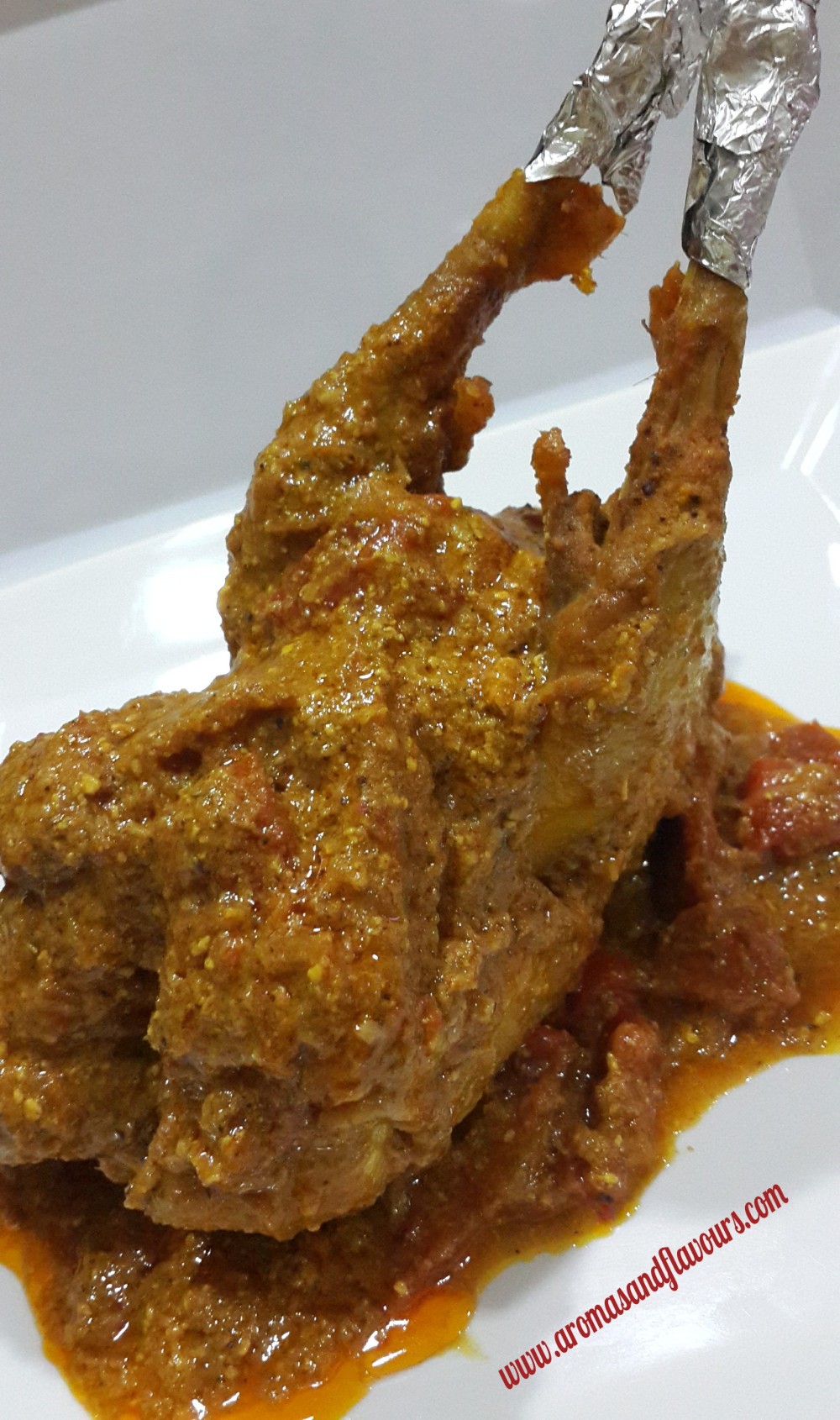 Whole chicken cooked in onion,tomato and yogurt gravy